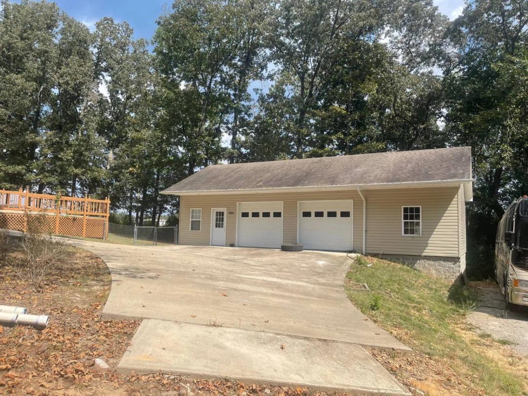 Exceptional 1-acre Homesite with Heated Garage &amp; Utilities