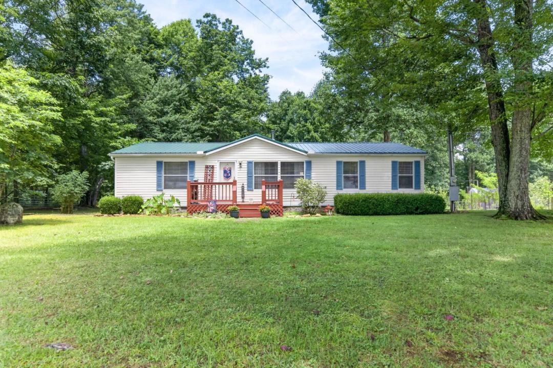 MINI FARM•7.74ACRES• GREENHOUSES• BARN• PASTURE• OUTBUILDINGS