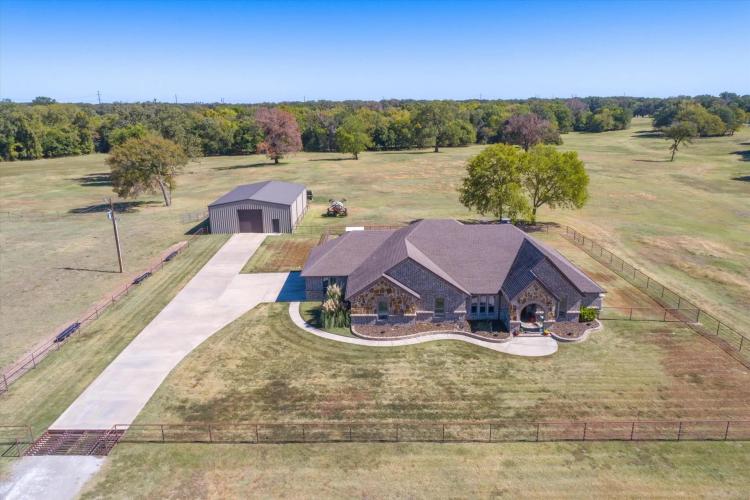 300 AC RANCH WITH STUNNING BRICK AND STONE HOME