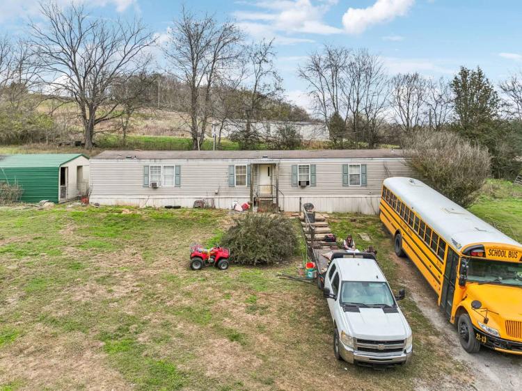 6.47 +/- acres w/ mobile home- BUILD NOW OR LATER!