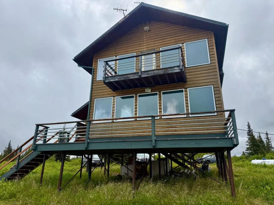 2 story hills cabin on road