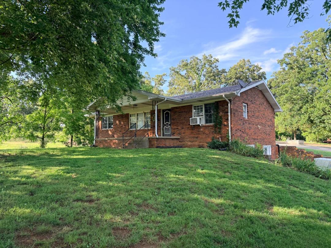 Brick Home on 16.9 Acres with Barn, Shop &amp; Walkout Basement