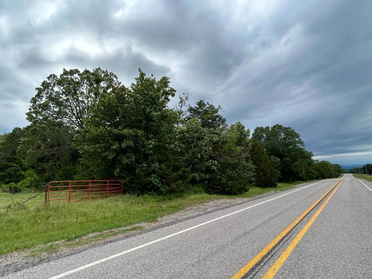Approx. Wooded Acres w/ Metal Shop on Paved Road