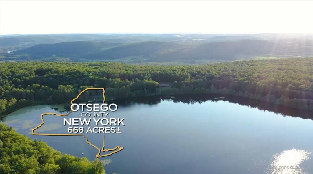 Exceptional lakefront former Camp, miles of trails &amp; timber