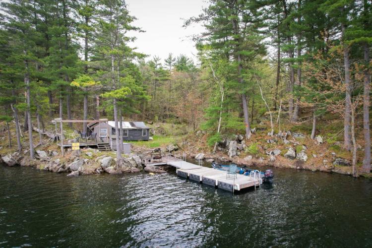 Rare Find Lakefront Oasis with Rustic Cabin and Private Dock