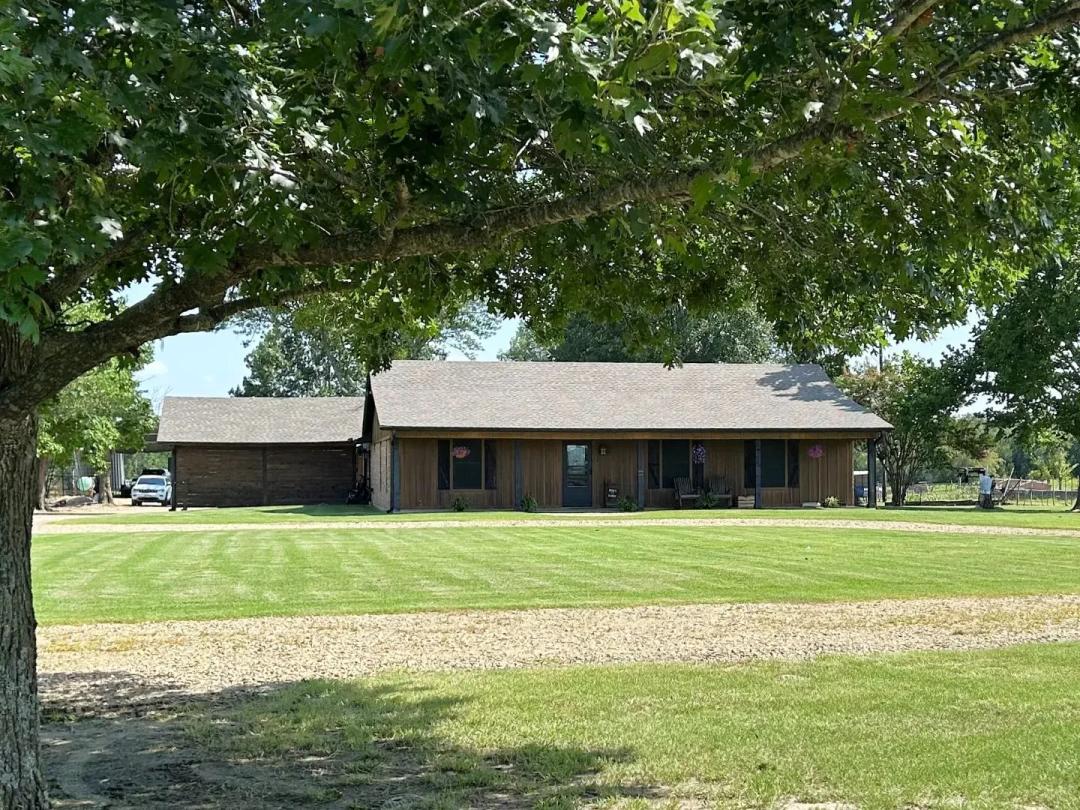 Country Home on 13 Acres with Shop & Pond