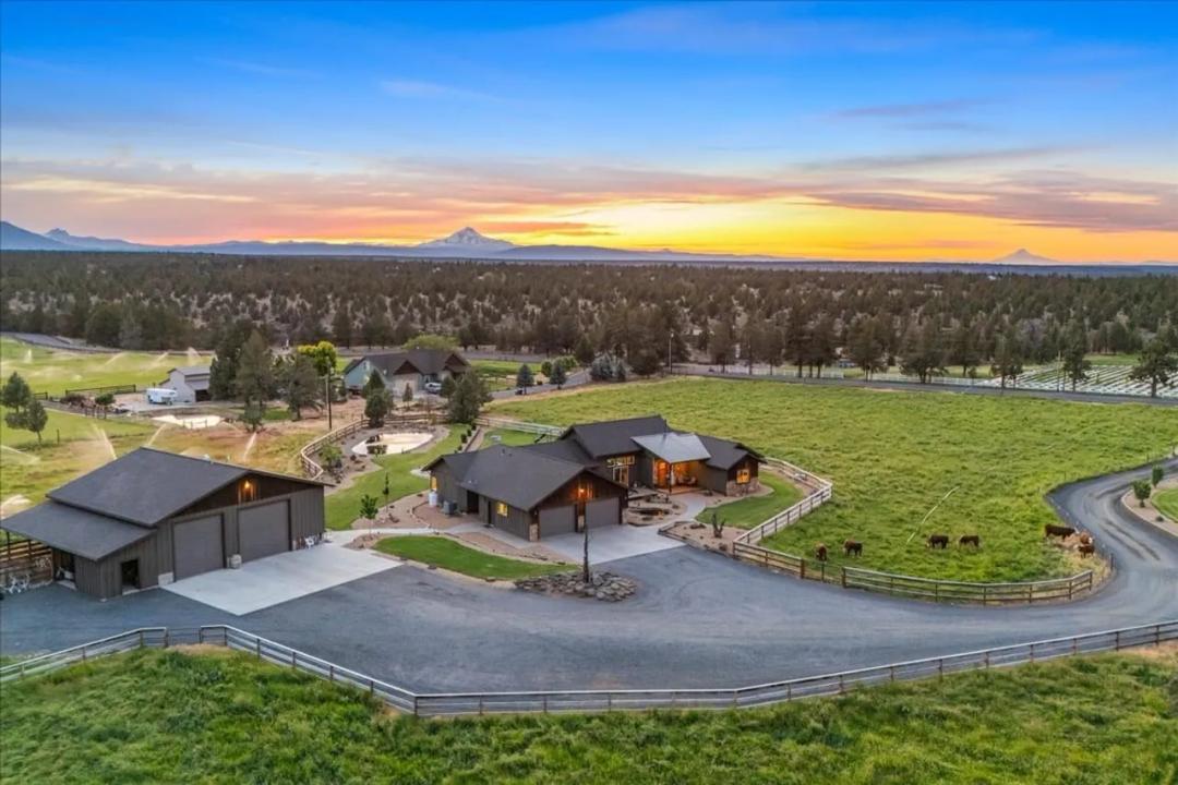 Incoming producing Ranch with two homes, shops and barn!