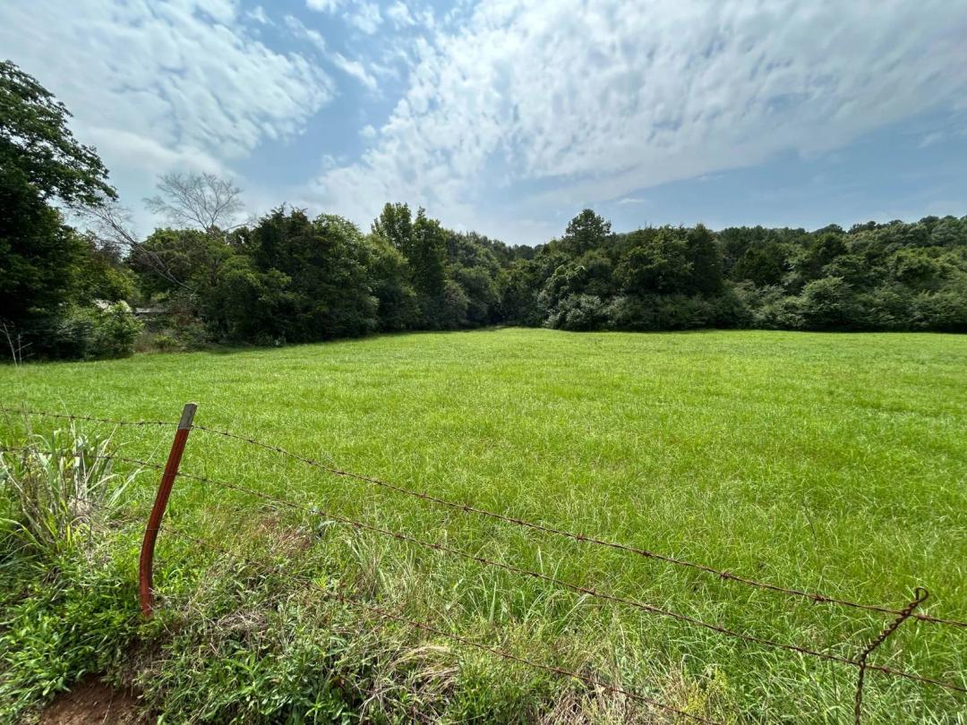 Approx. 3 1/2 Acres on Paved Road with Creek and Woods
