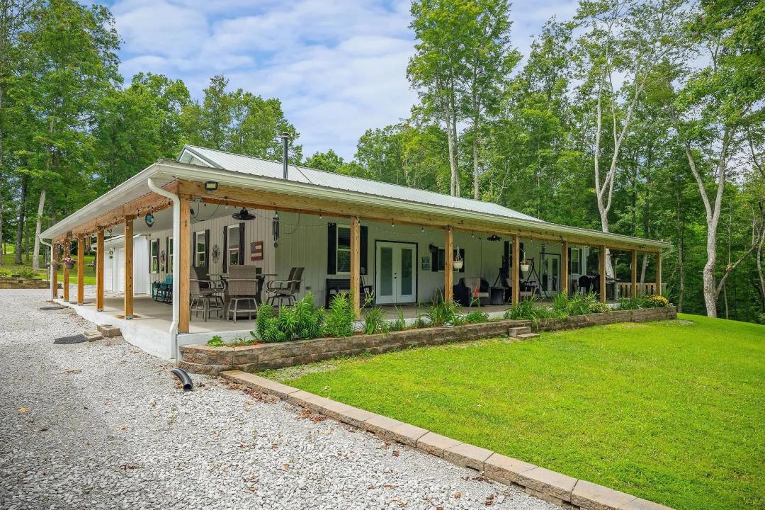 16.20 AC RANCH with 2 site-built homes and being sold together. CUSTOM BUILT HOMES WITH OUTBUILDINGS, POND , CREEK  & A POLE BARN.
