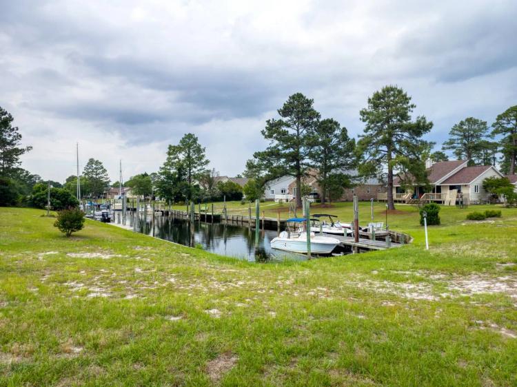 Corner waterfront lot located in established community!