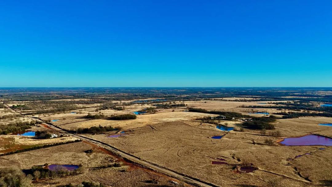 18± acres with blacktop frontage, ponds, and prime homesite potential!