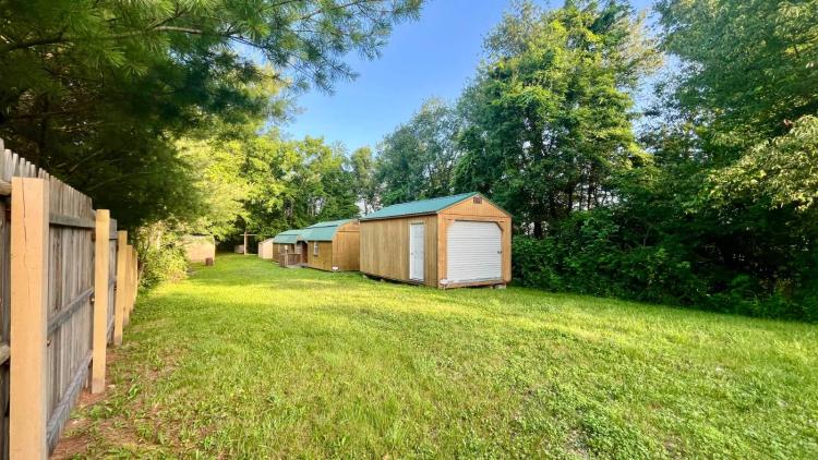 Two Cabins + Storage buildings on 13 wooded acres w/ Electric