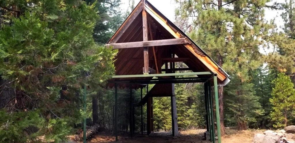Heavily Forested property with incomplete steel pole metal roof shed/barn