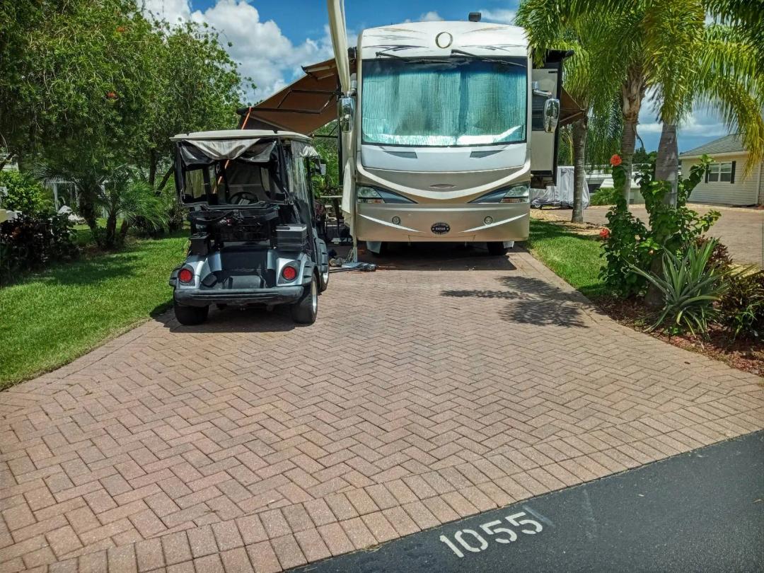 Aggressive price on brick paved, lushly landscaped lot