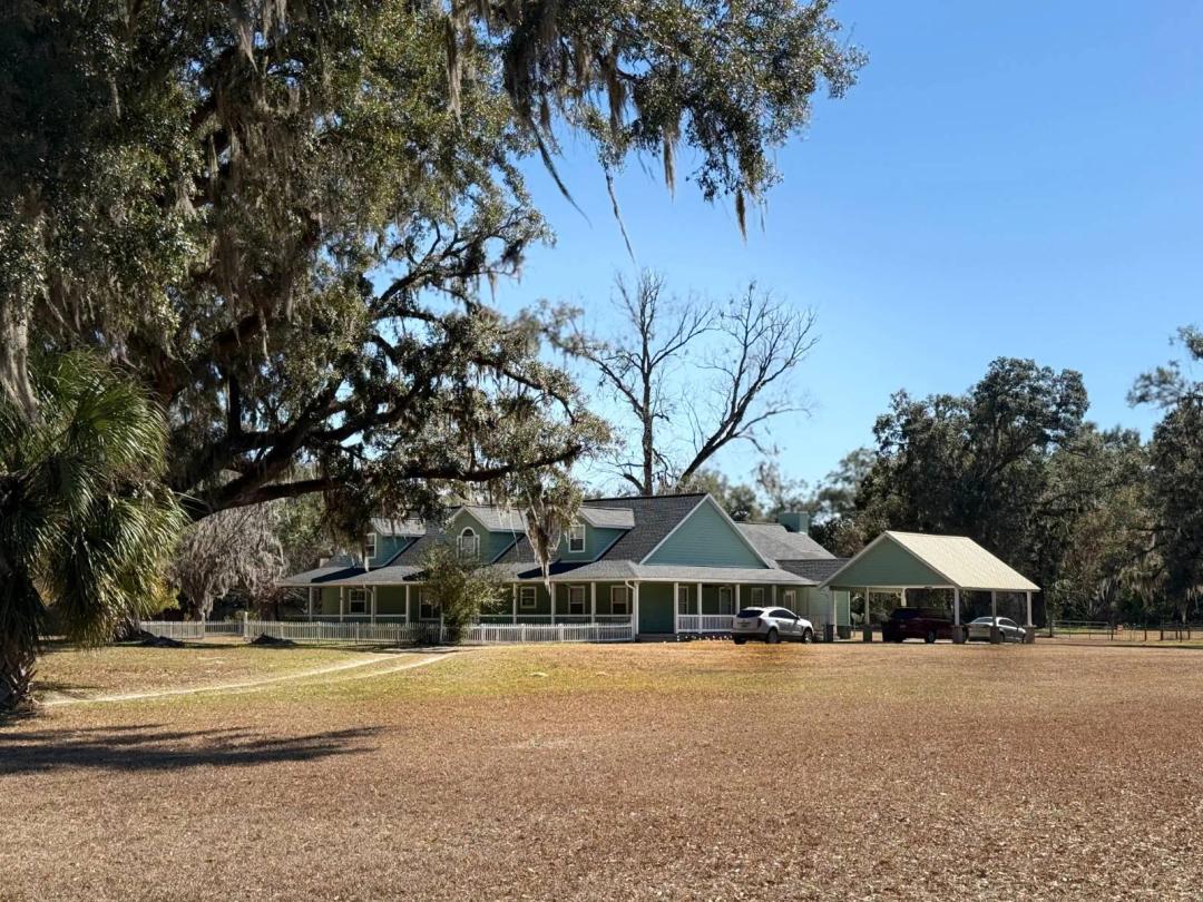 7.45 acres. 3 Living Spaces. 4 baths. Gilchrist County, FL Taxes