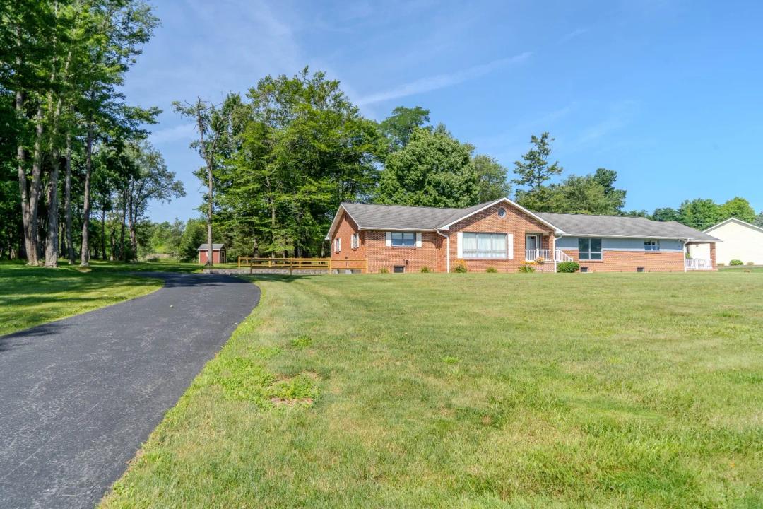 Brick ranch on private, level lot near Johnstown amenities