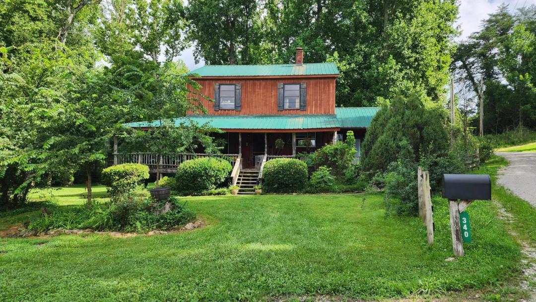15.48 AC W/ RUSTIC 2 STORY HOME. 2 CAR GARAGE, BARN, SHEDS, YR AROUND CREEK, MOSTLY LEVEL, TRAILS, IDEAL FOR HORSES, GREAT MINI FARM