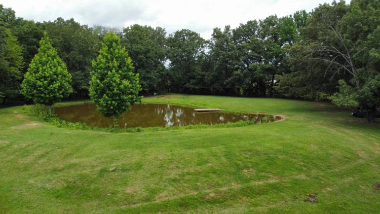 4.7 Acres with Stocked Pond, Mature Trees &amp; Utilities
