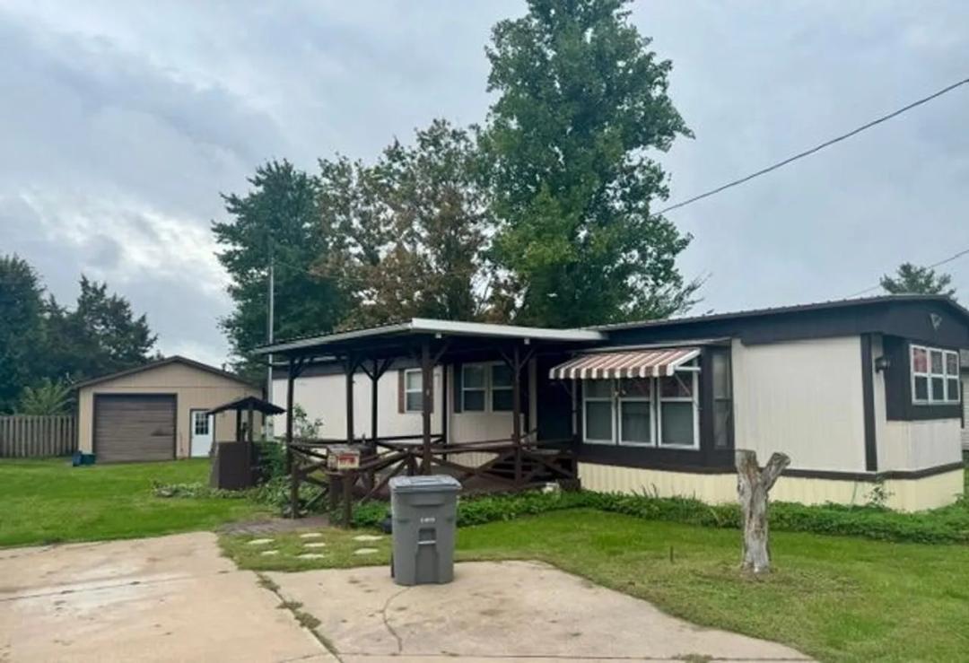 Manufactured home, nice lot, with garage and shed 