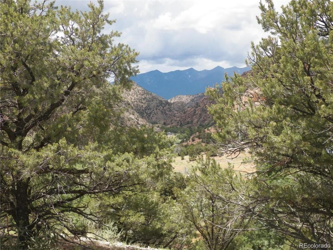 19.69 acres with spectacular views of the Sangre de Cristo Mountain Range located in the charming river front community of Cotop