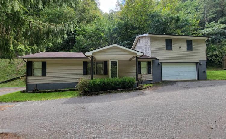 Beautiful home with 31 acres, a barn, hiking trails, etc.