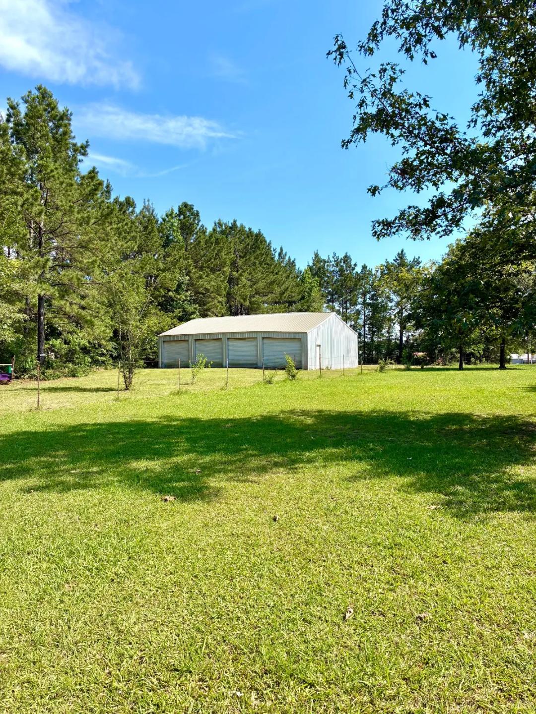 Beautiful .94 acre Lakeside Community with a Huge 4 Bay Shop!