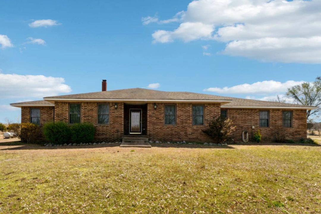 This charming 4-bedroom, 3-bathroom home with 40x70 shop