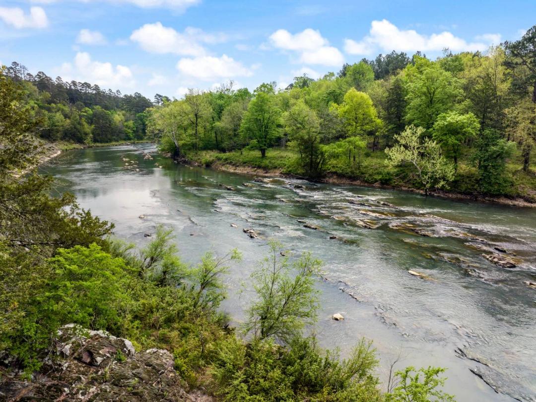 7.3+/-  acres with direct access to Mountain Fork River!