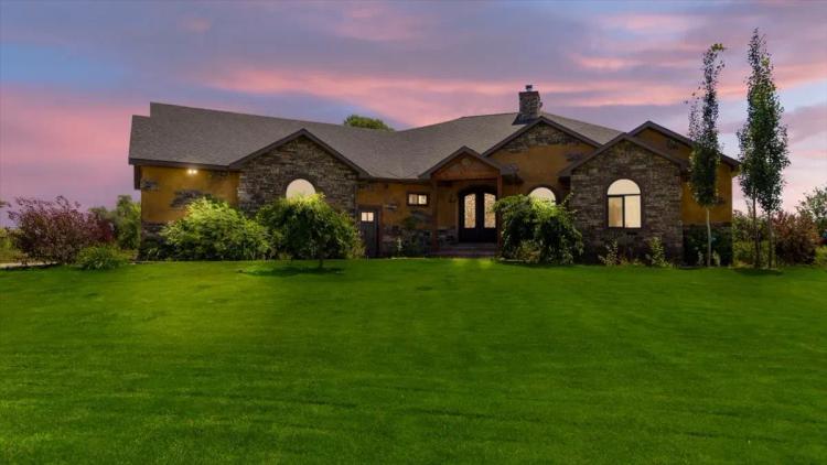 Beautiful Country Home Nestled on 10 Acres with Water Rights, Barn, Horse Barn, and Solar Power