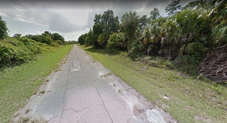Retire in Comfort on Canal Front with Fishing Lake Access in Florida! - 0.23 Acres