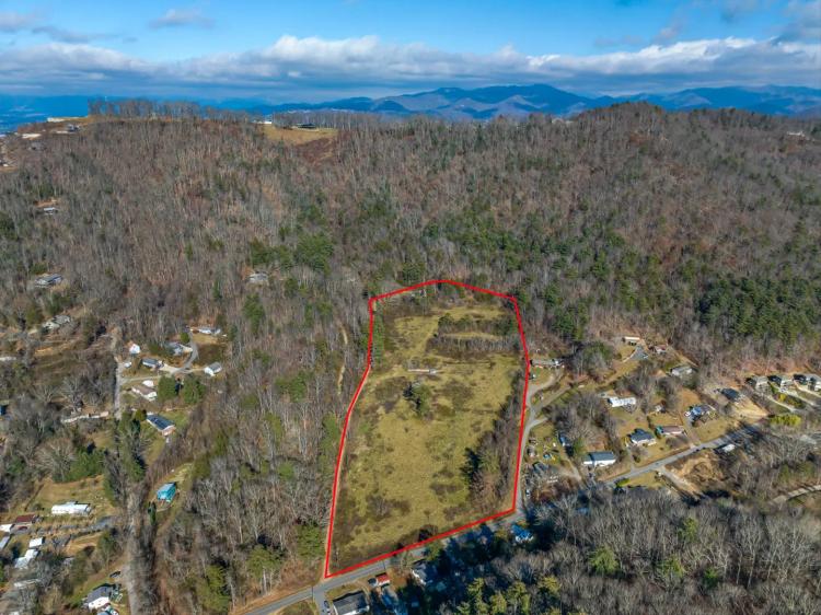 Mostly cleared & shovel ready 12.04+/- acre multi-family development parcel located only 10 minutes north of Downtown Asheville