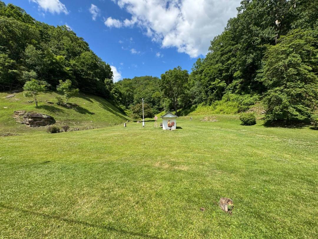 Half Acre Camp Site with Utilities with Potential for a Home!