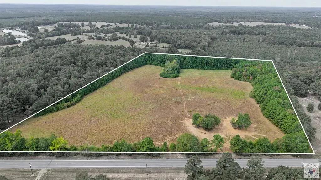 25 Acres of Land for Sale in Atlanta, TX - Pond, Timber & Hunting!