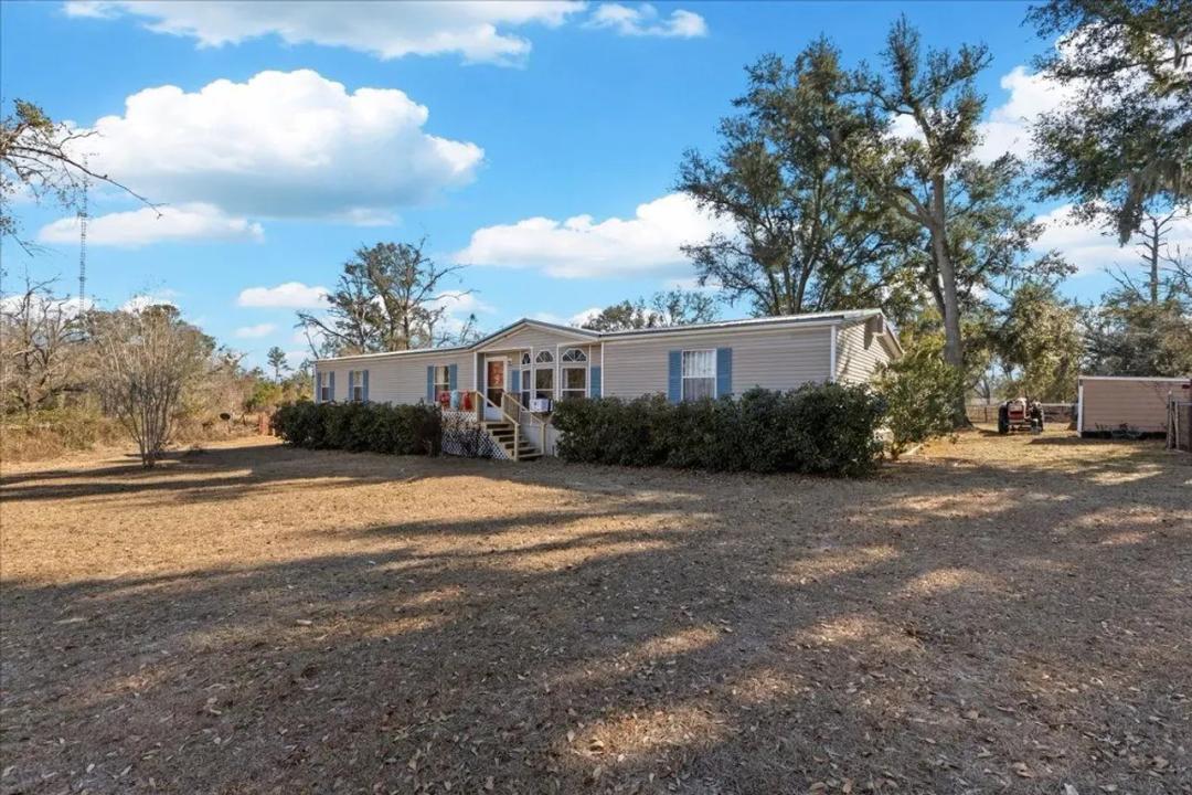 Turnkey 40.23-Acre Mini Farm with Home, Ponds & Cross-Fencing