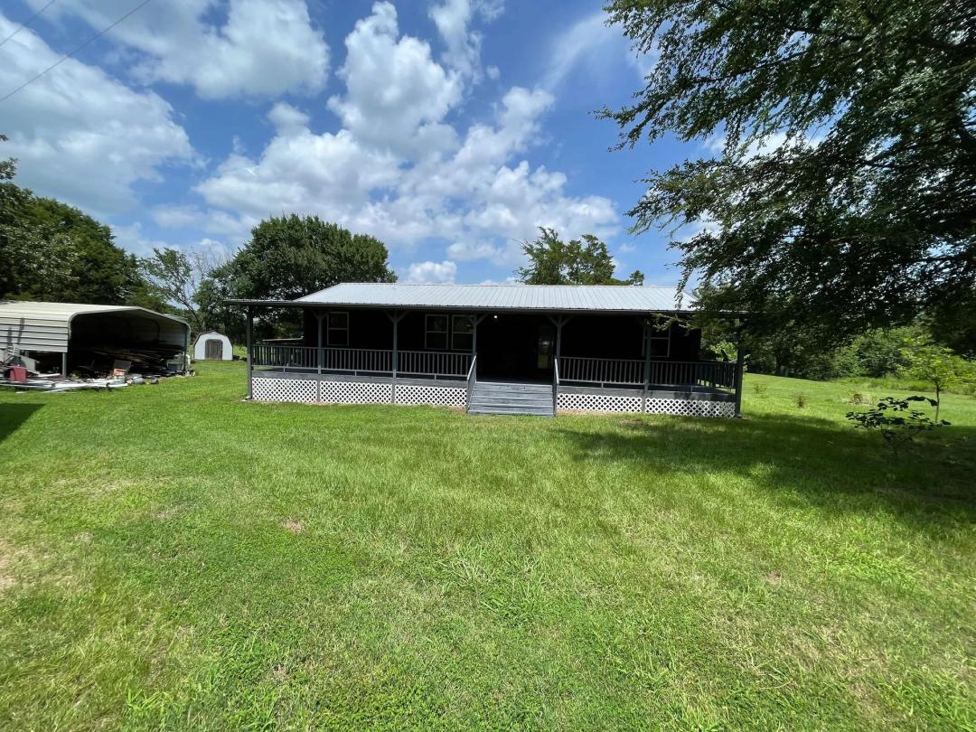 Sardis Lake property: Lake House with outbuildings