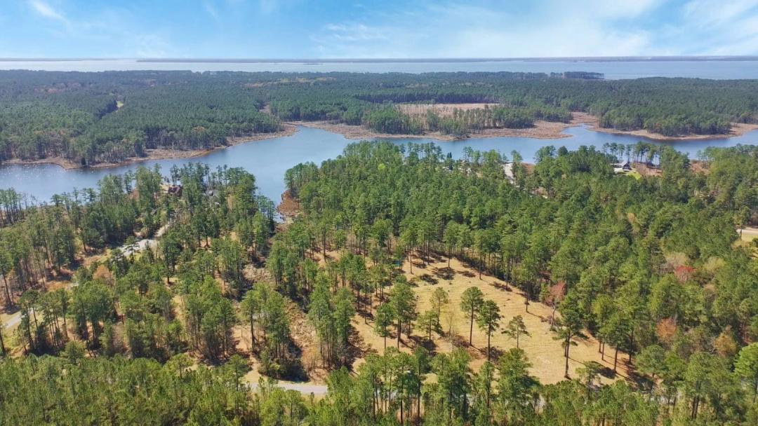 Beautiful 2+ acre property in gated waterfront community!